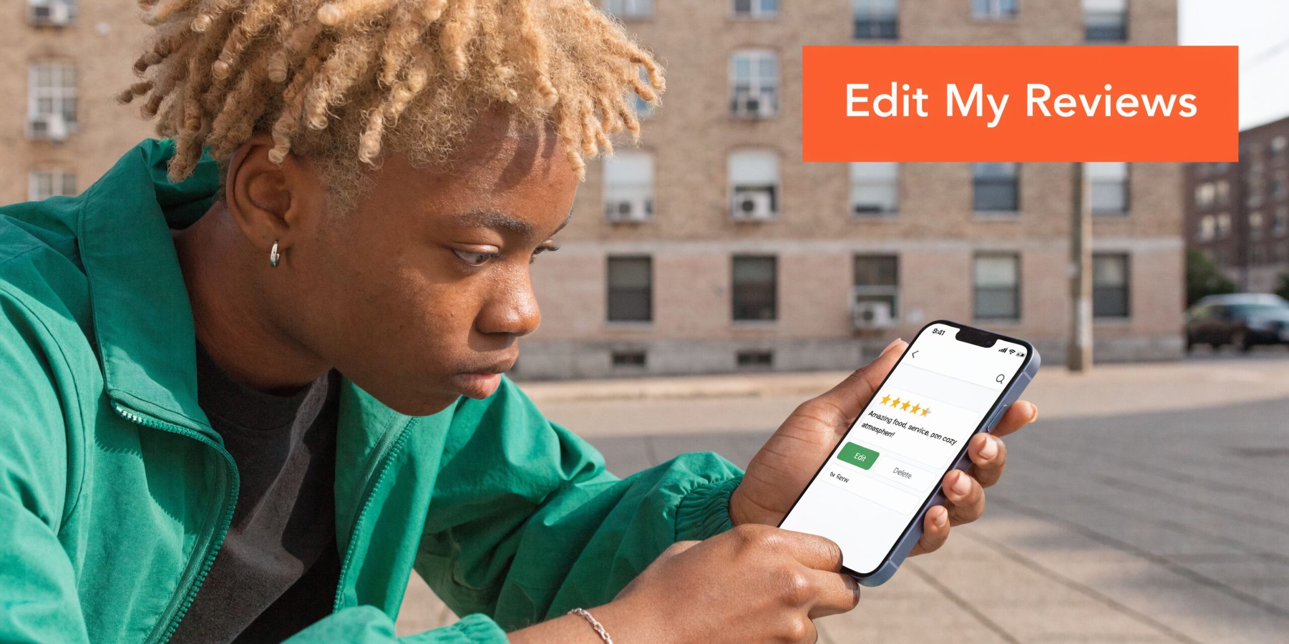 A young person with blonde hair holding a smartphone to view and manage their personal online business reviews.
